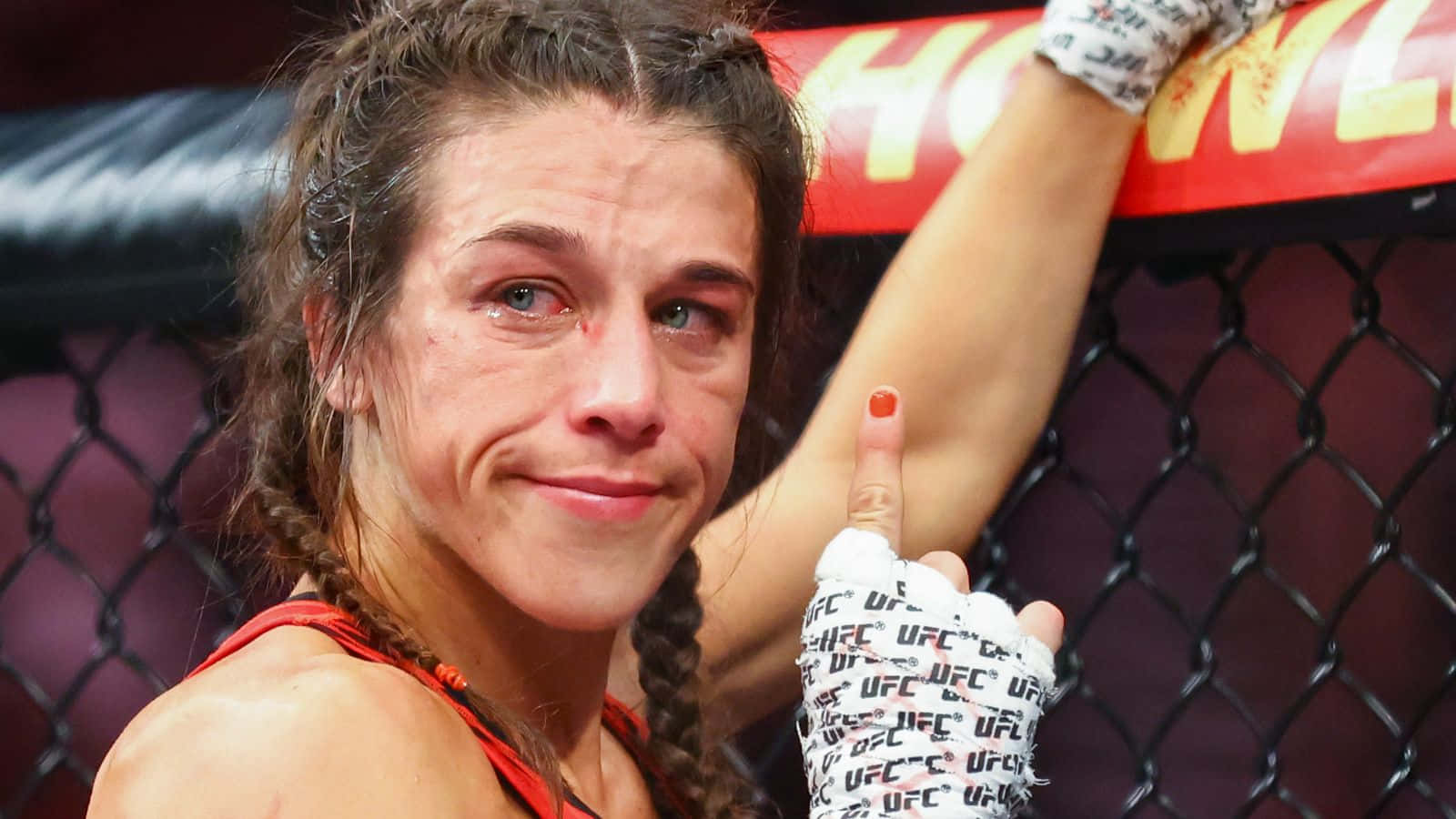 Caption: Joanna Jedrzejczyk - The Signature Fighting Stance Background