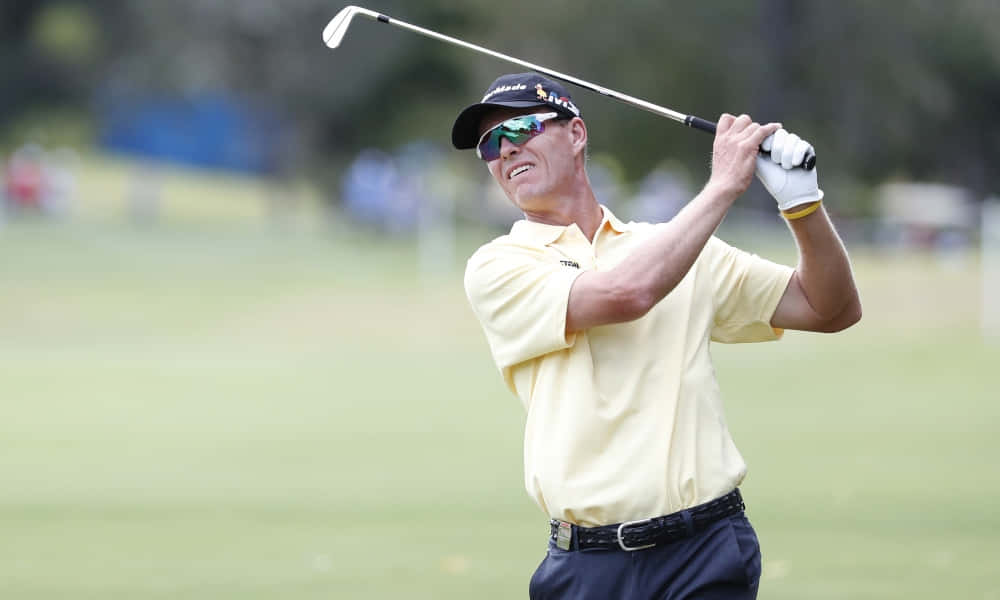 Caption: John Senden Celebrating An Excellent Post-swing Posture Background