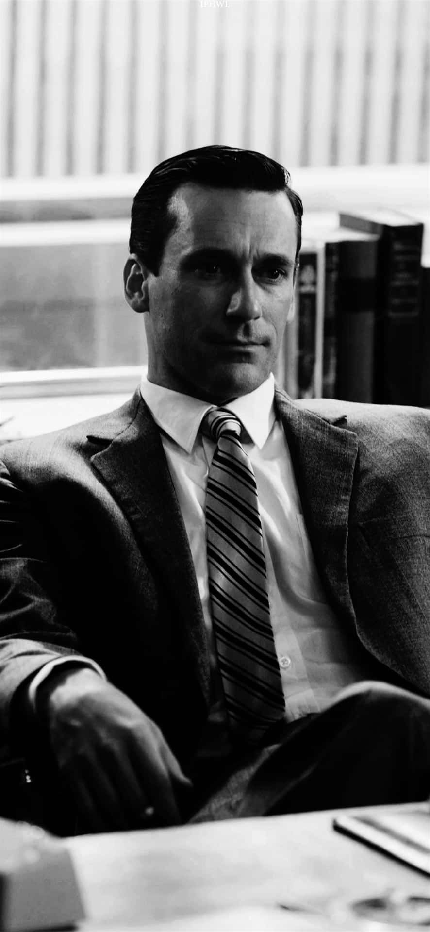 Caption: Jon Hamm Exhibiting Classic Men's Suit Style Background