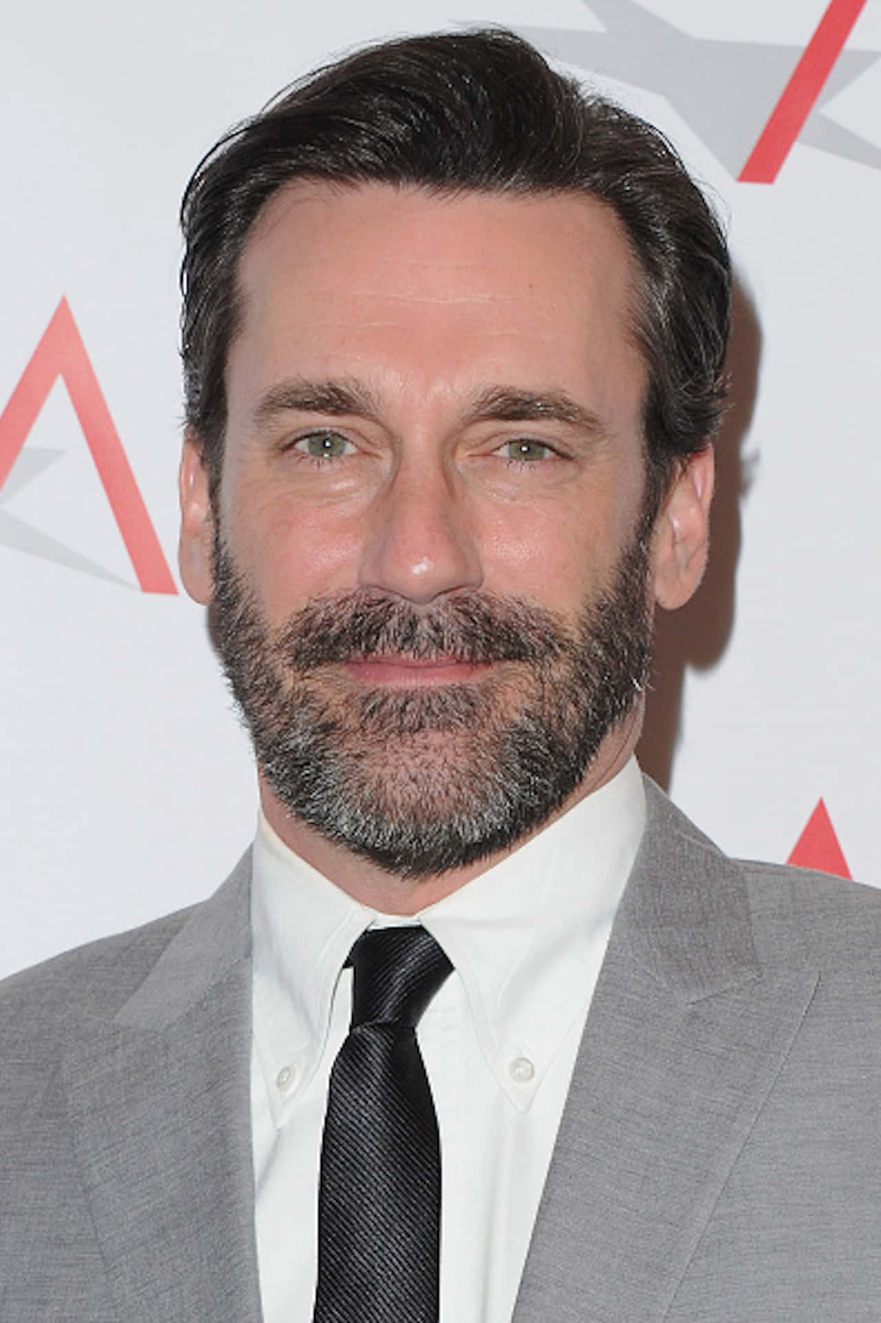 Caption: Jon Hamm - The Hollywood Charmer Background