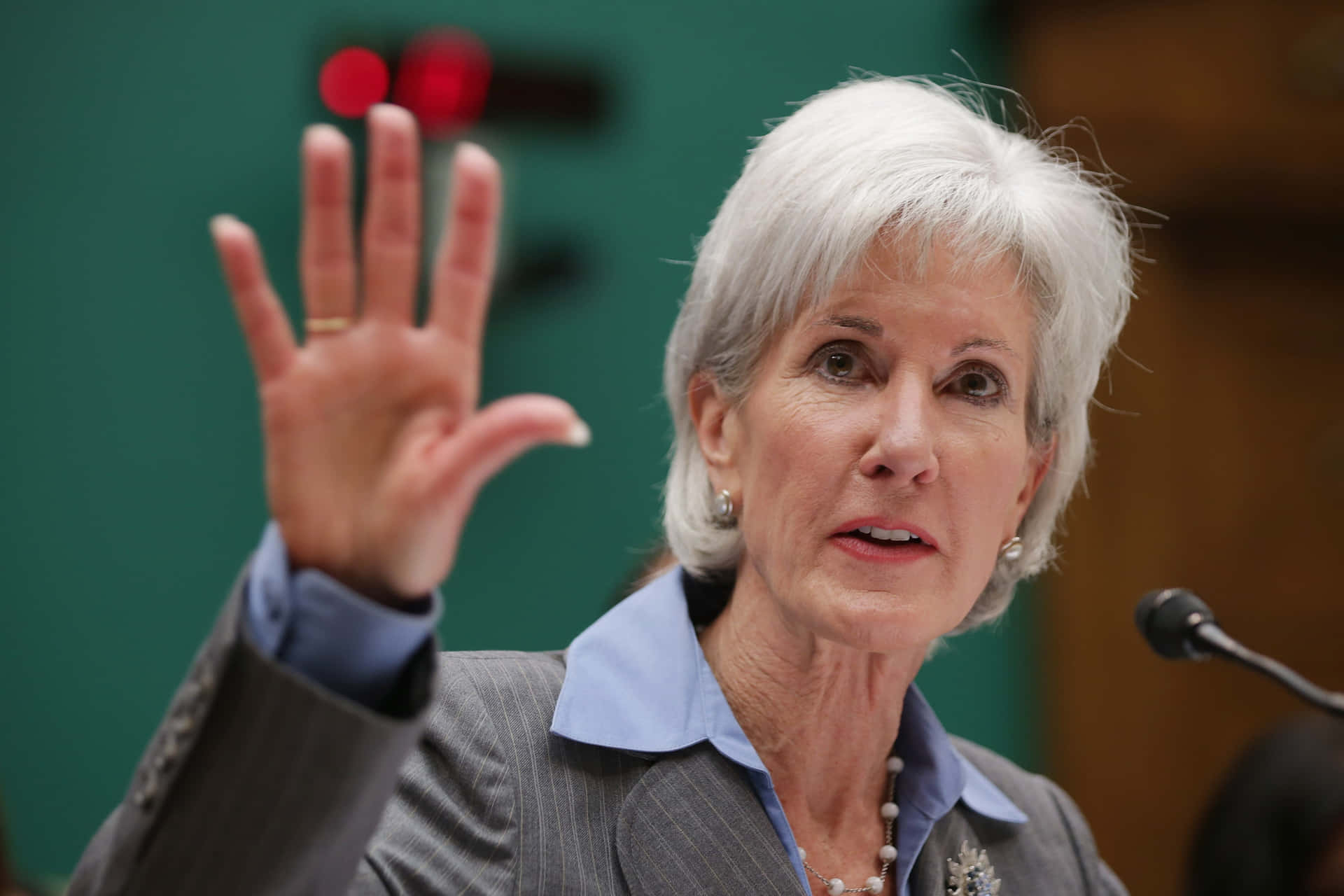 Caption: Kathleen Sebelius Presenting A Public Speech Background