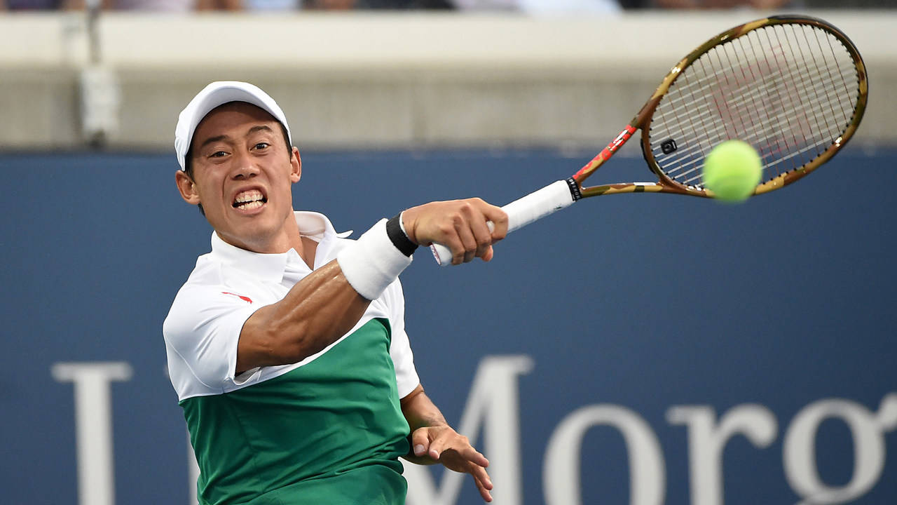 Caption: Kei Nishikori Executes A Dynamic Backhand Stroke. Background