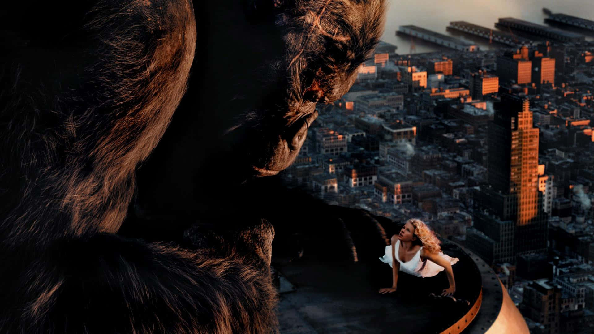 Caption: King Kong Roaring On Top Of The Empire State Building Background