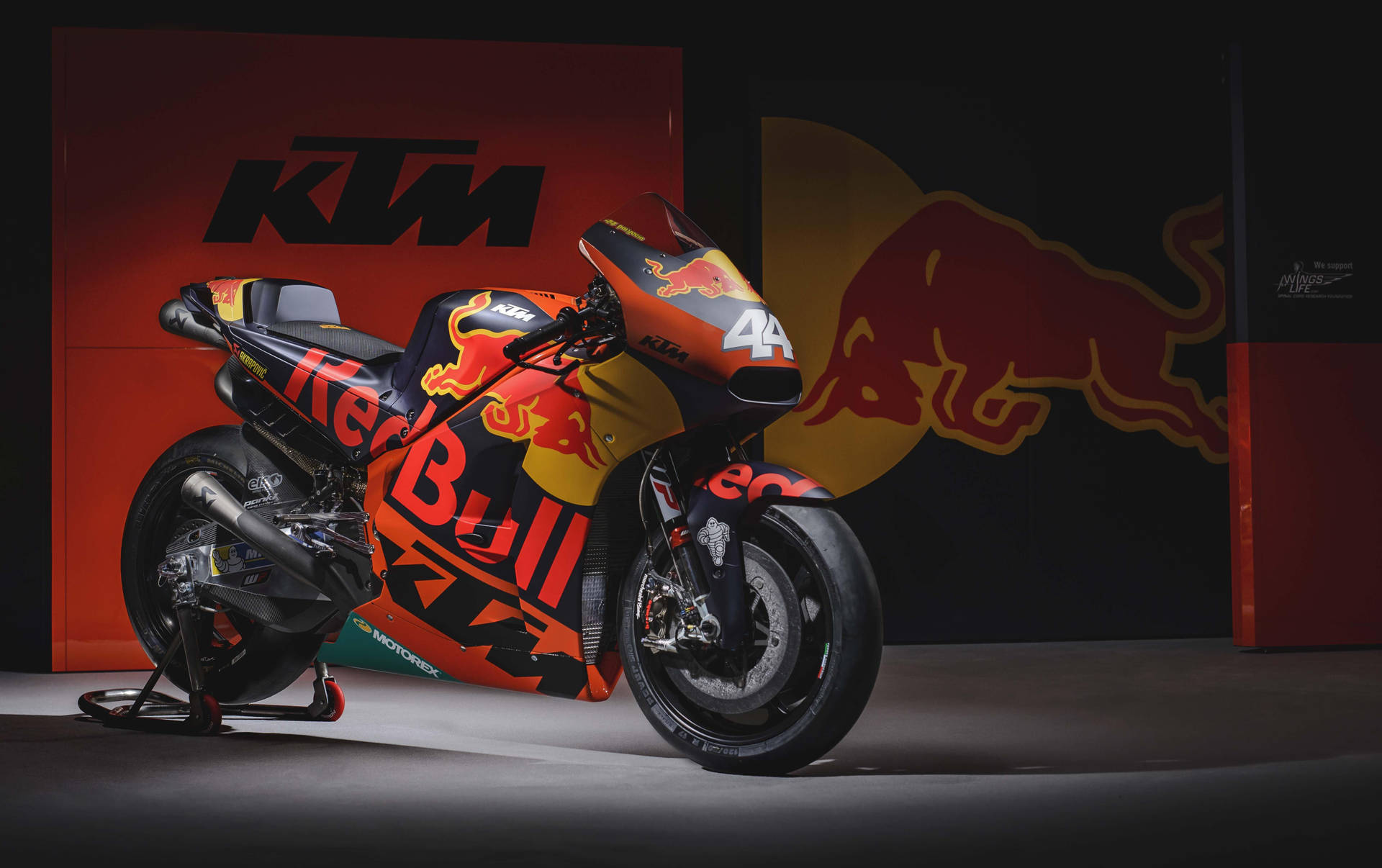 Caption: Ktm 4k Motorcycle Adorned With Red Bull Accents Background