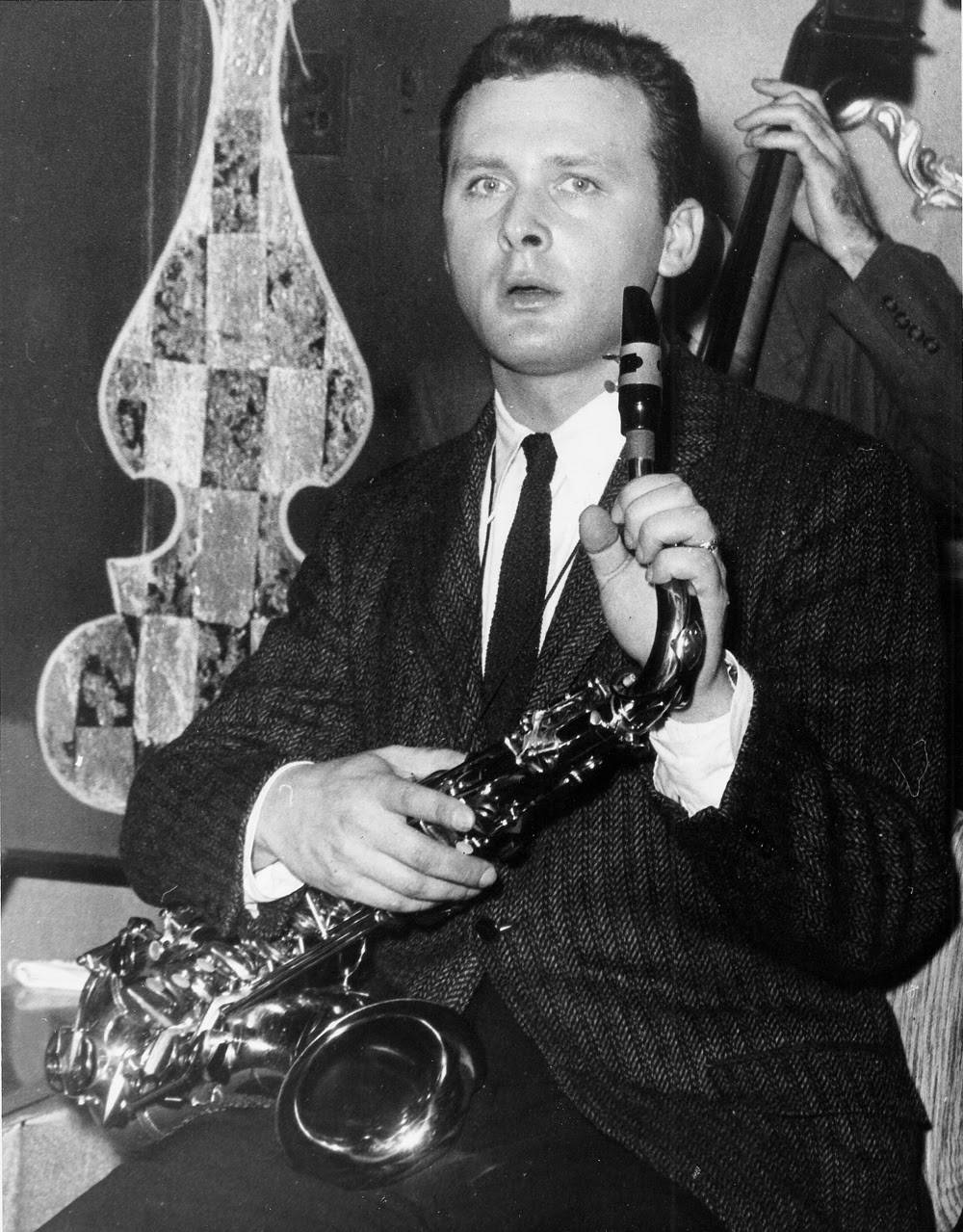 Caption: Legendary American Saxophonist Stan Getz: A Monochromic Portrait Background