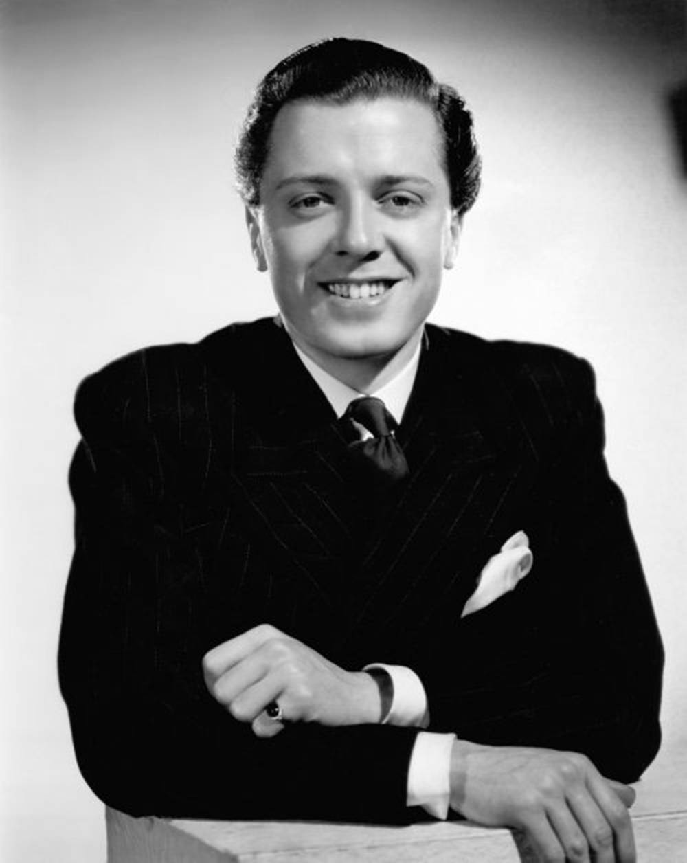 Caption: Legendary Director Richard Attenborough In A Classic Suit Background