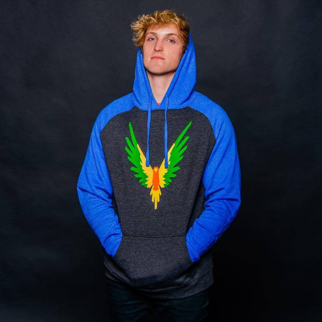 Caption: Logan Paul, A Significant Online Influencer, In A Candid Shot. Background
