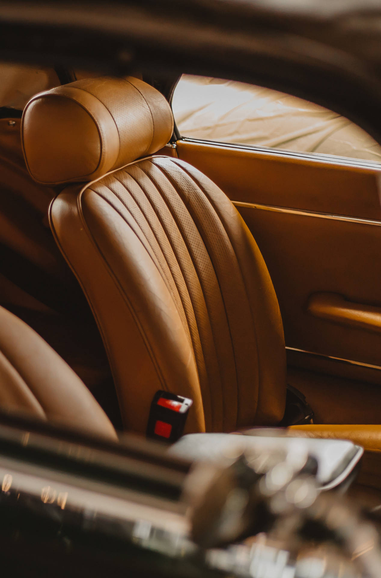 Caption: Luxurious Brown Car Seats Background For Iphone Background