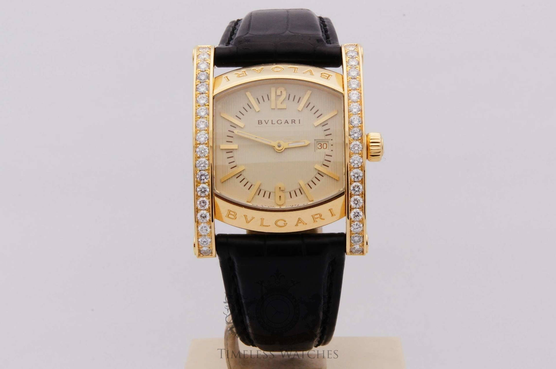 Caption: Luxurious Gold And Black Bvlgari Watch Background