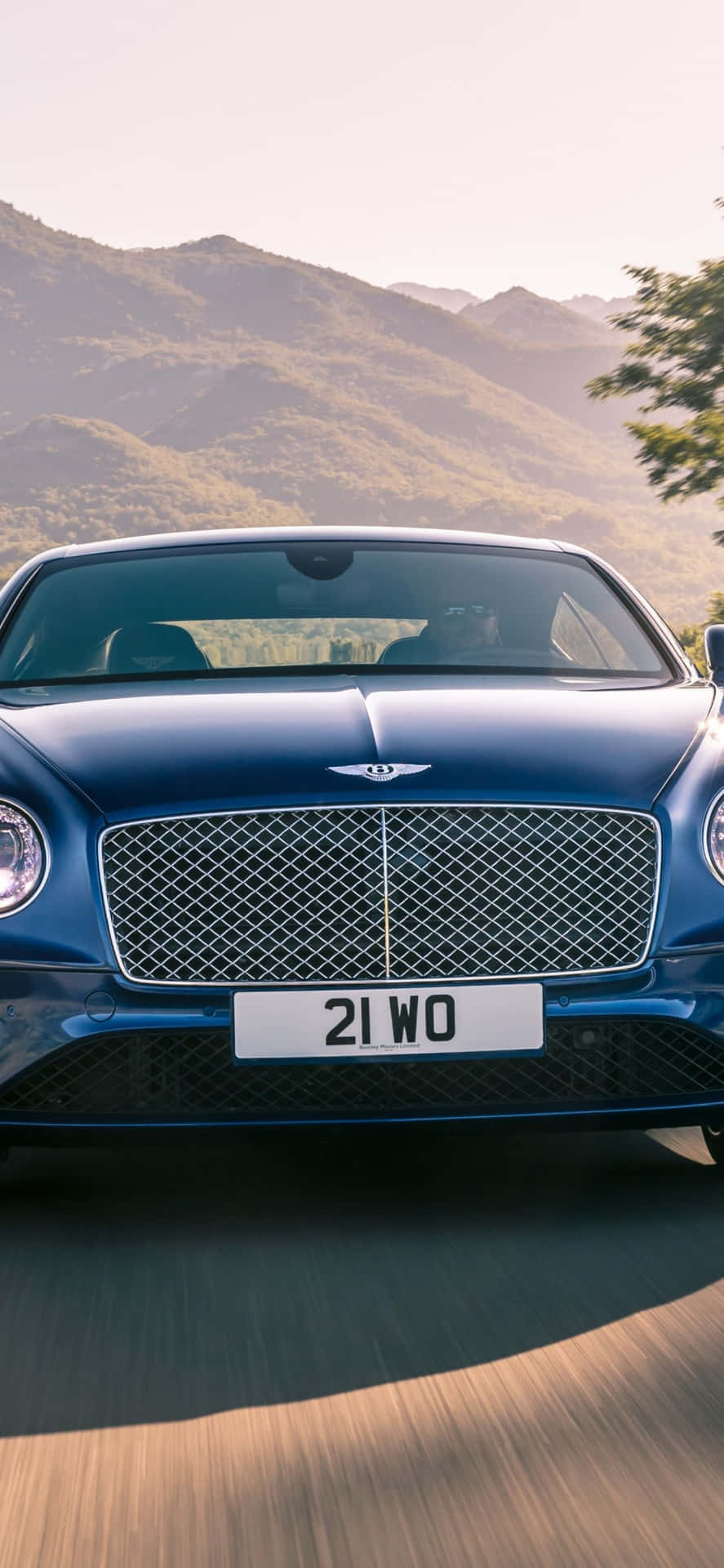 Caption: Luxurious Ride On A Bently With Iphone Background