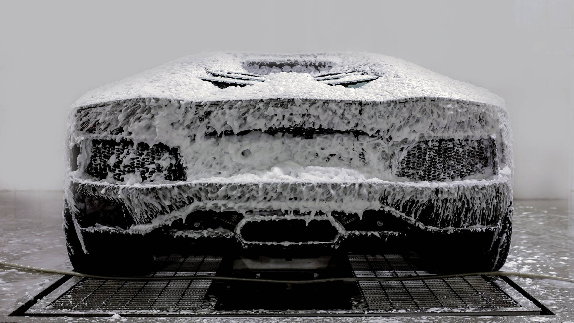Caption: Luxury Lamborghini Car Wash Background