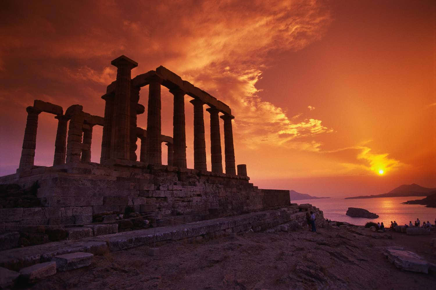Caption: Magnificent Sunset Over Poseidon's Temple In Sounion Background