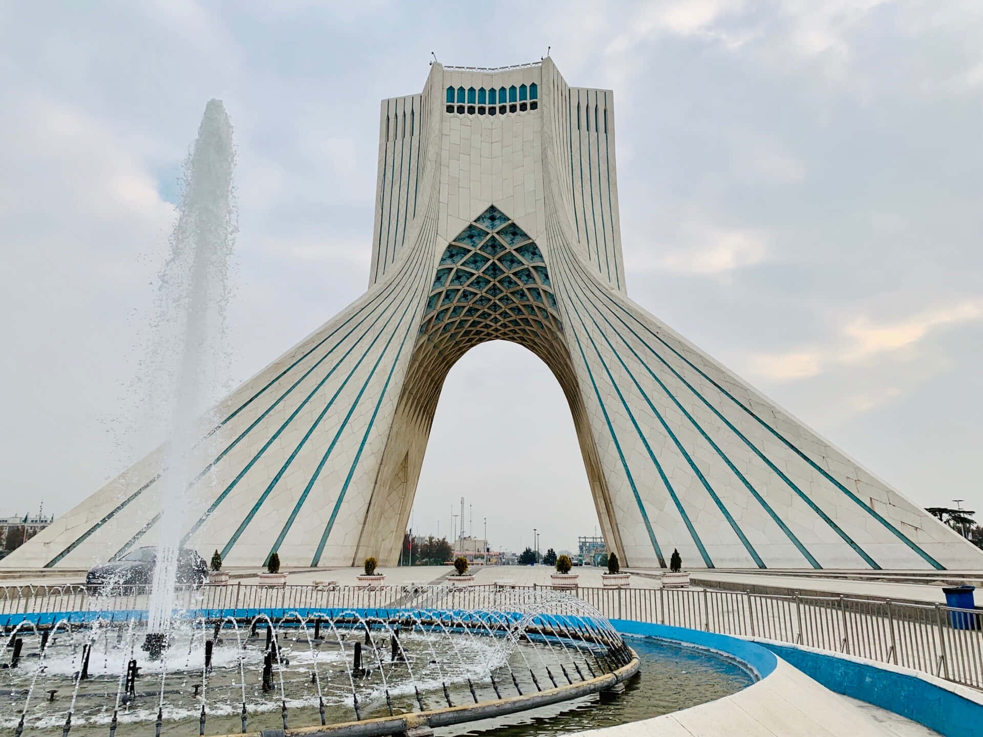 Caption: Magnificent View Of Azadi Tower With Fountain At Twilight Background