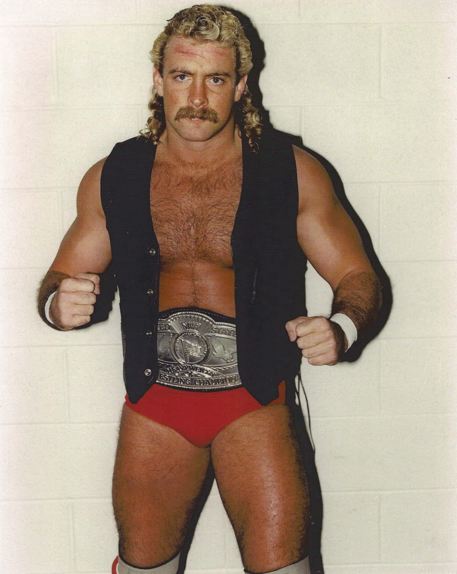 Caption: Magnum Ta: An Impeccable Prowess In American Wrestling. Background