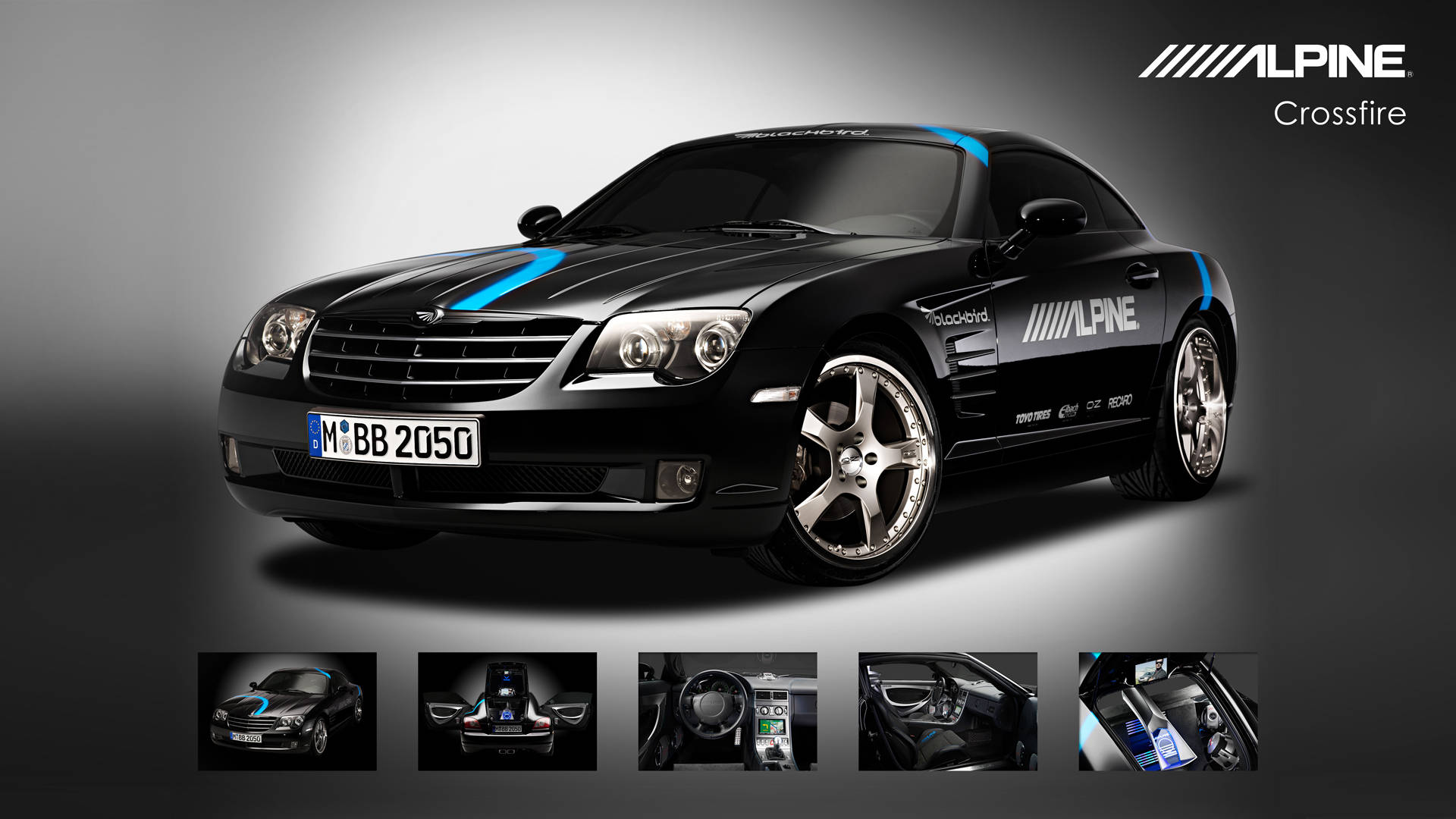 Caption: Majestic Black Alpine Chrysler Crossfire Amidst Mountainous Landscape