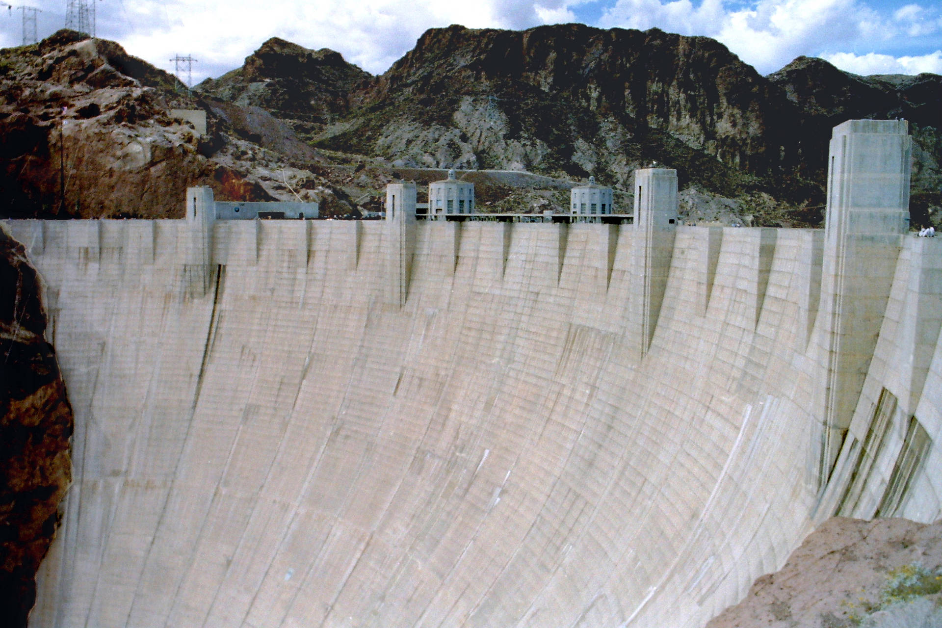 Caption: Majestic Curve Of The Hoover Dam Background