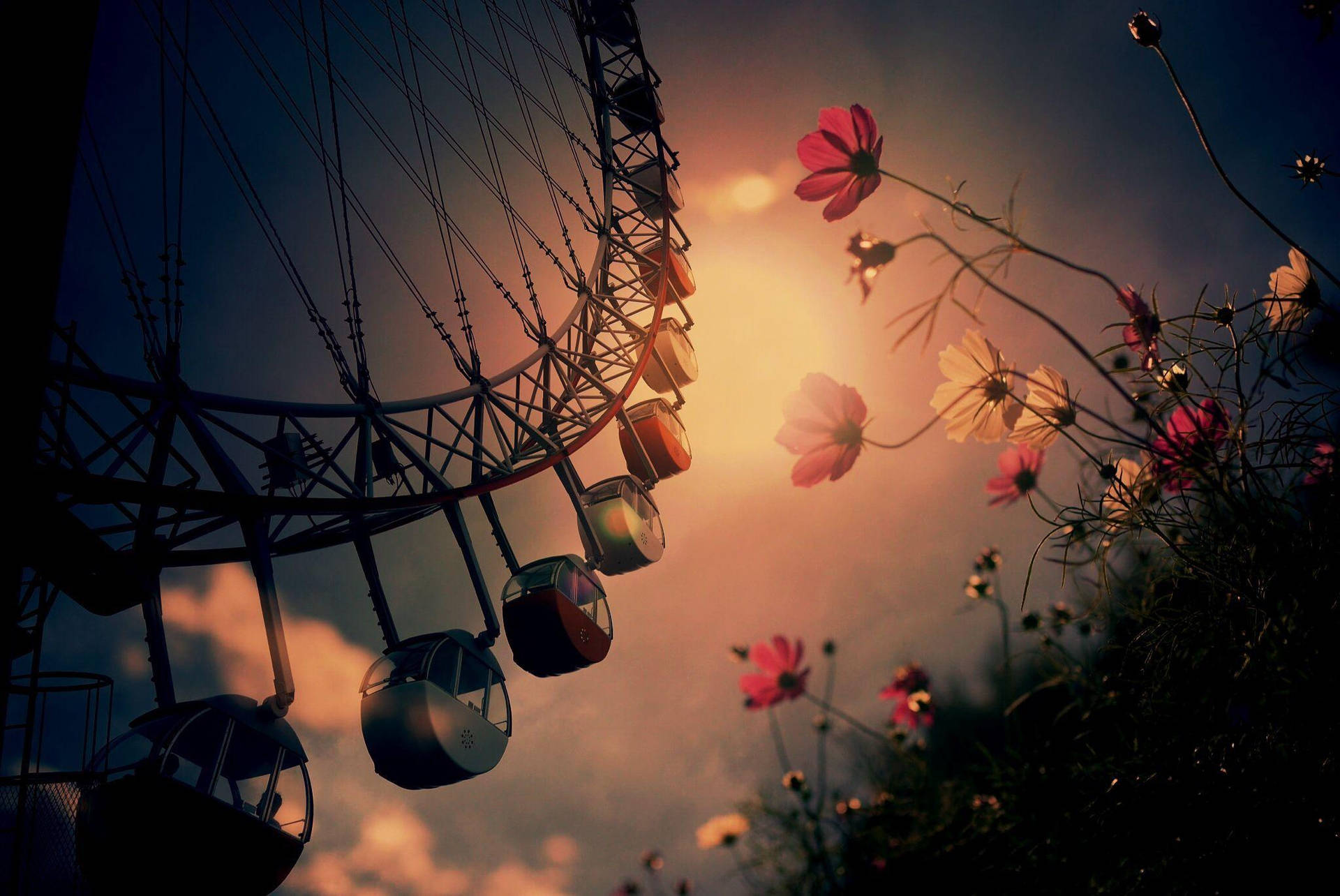 Caption: Majestic Ferris Wheel Adorned With Vibrant Flowers Background