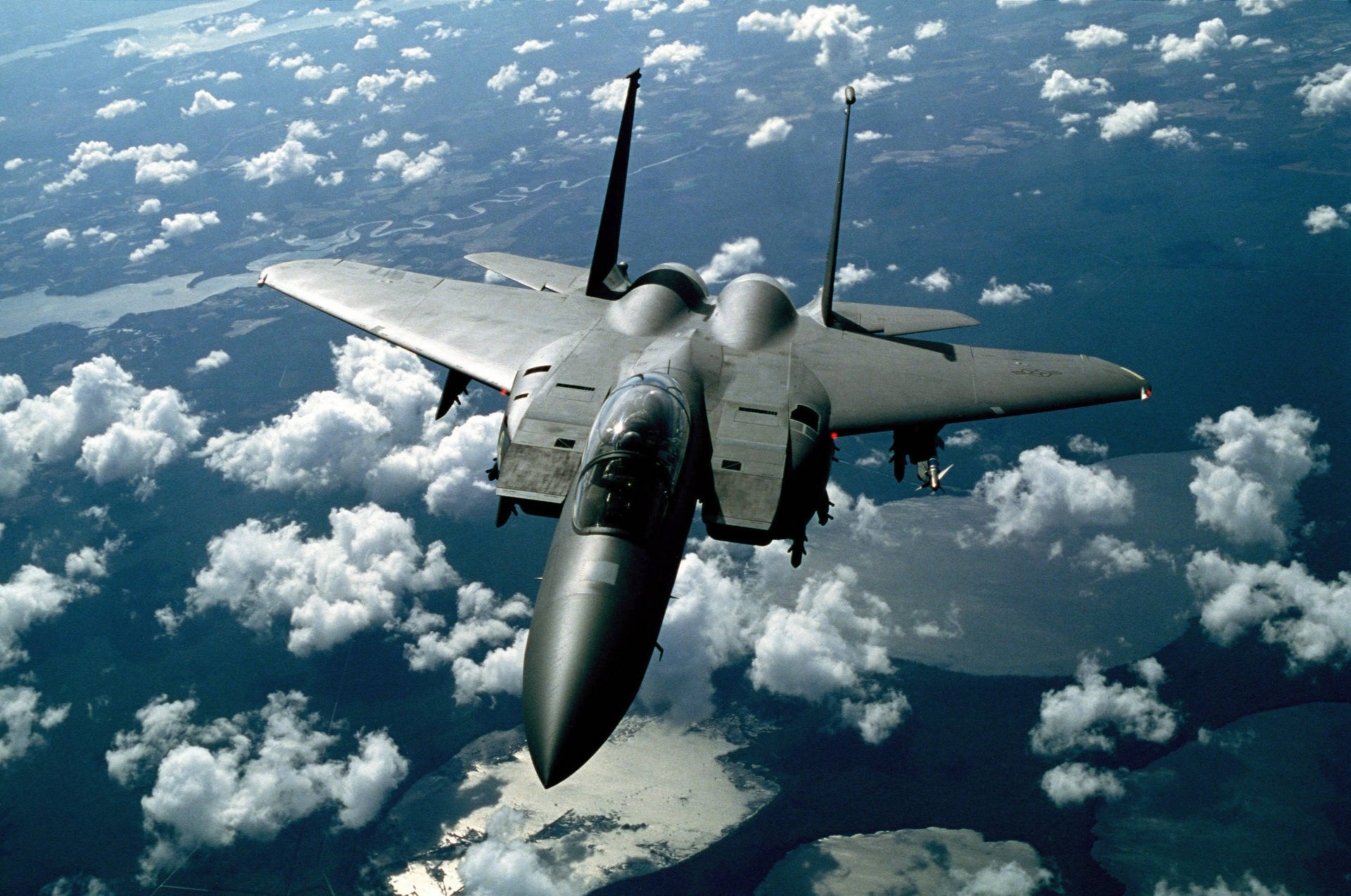 Caption: Majestic Flight Of The Mcdonnell Douglas F-15 Eagle Jet Fighter Background