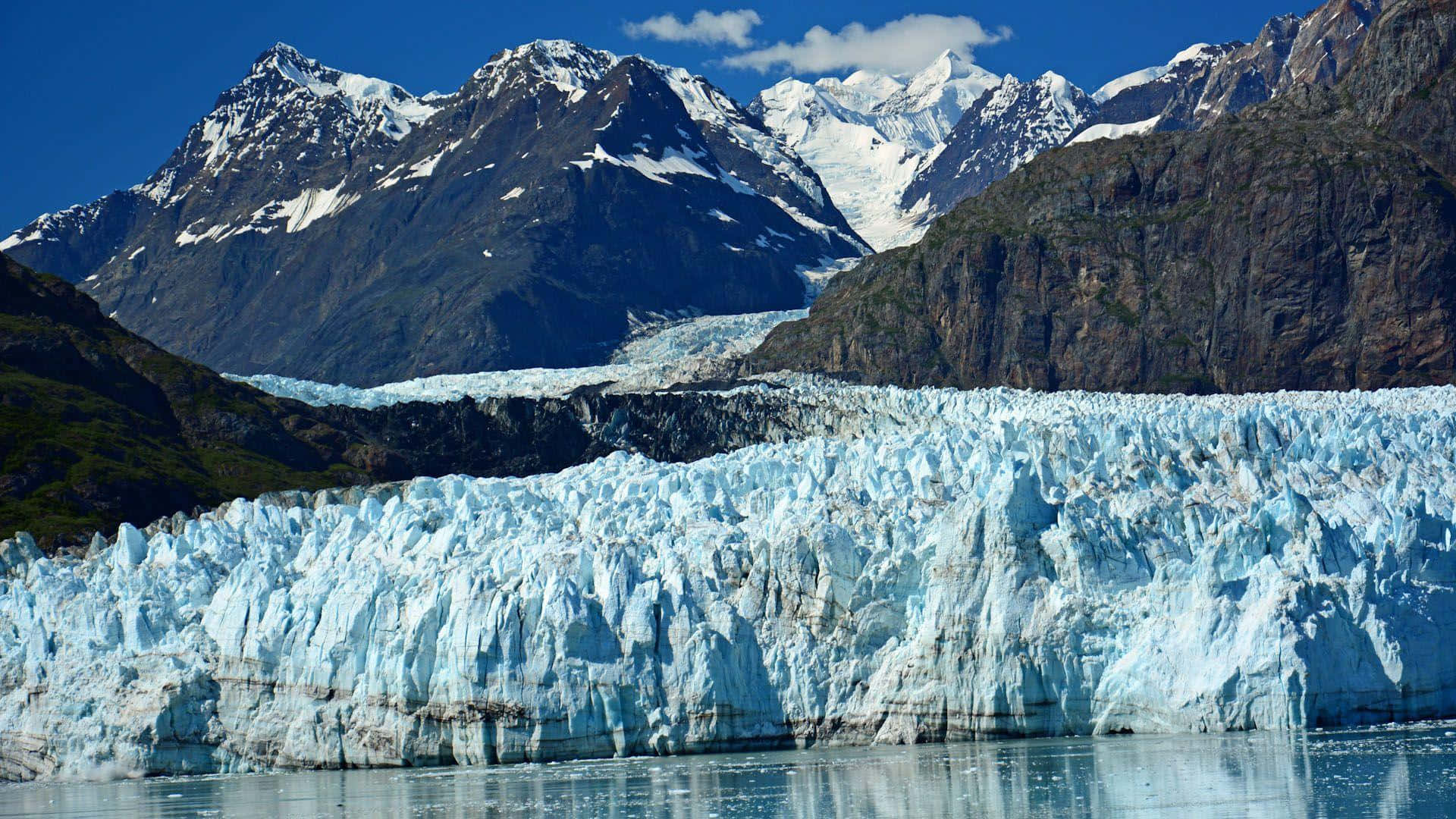 Caption: Majestic Glacier Face In Glacier Bay National Park Background