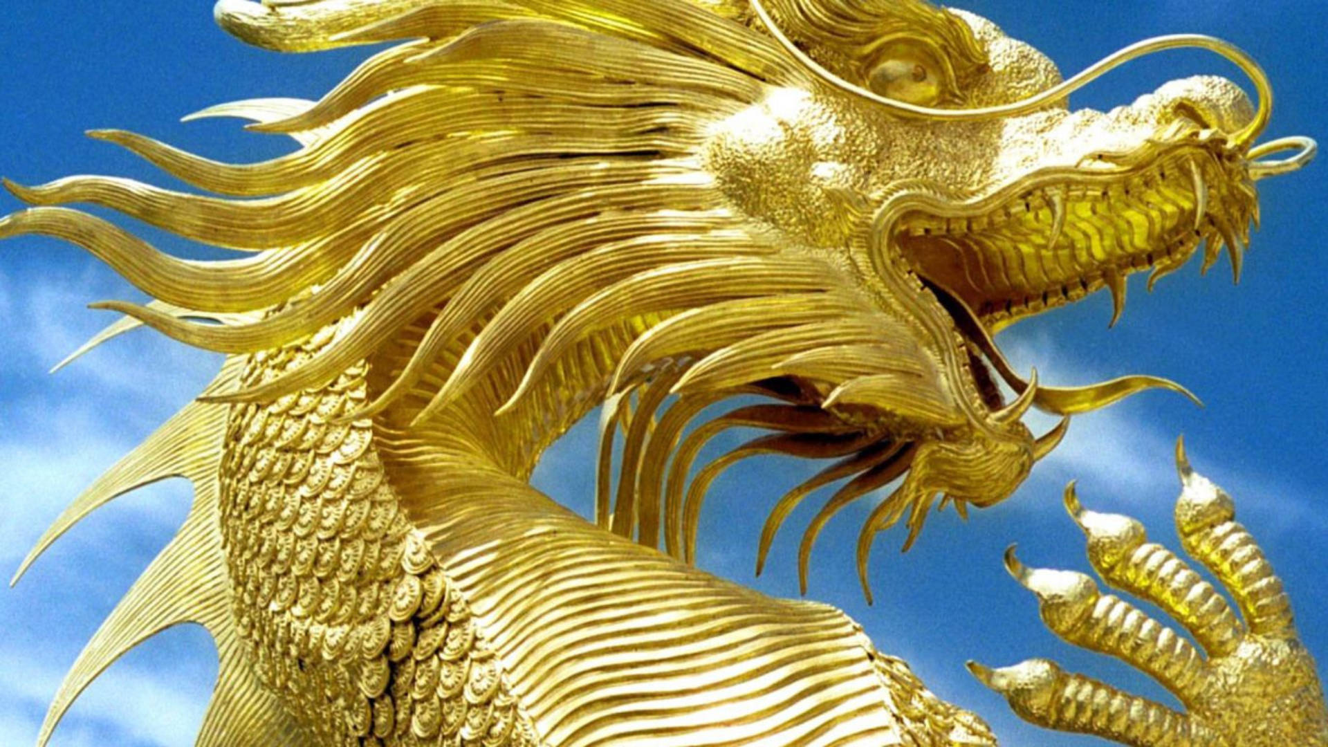 Caption: Majestic Golden Dragon Sculpture Background