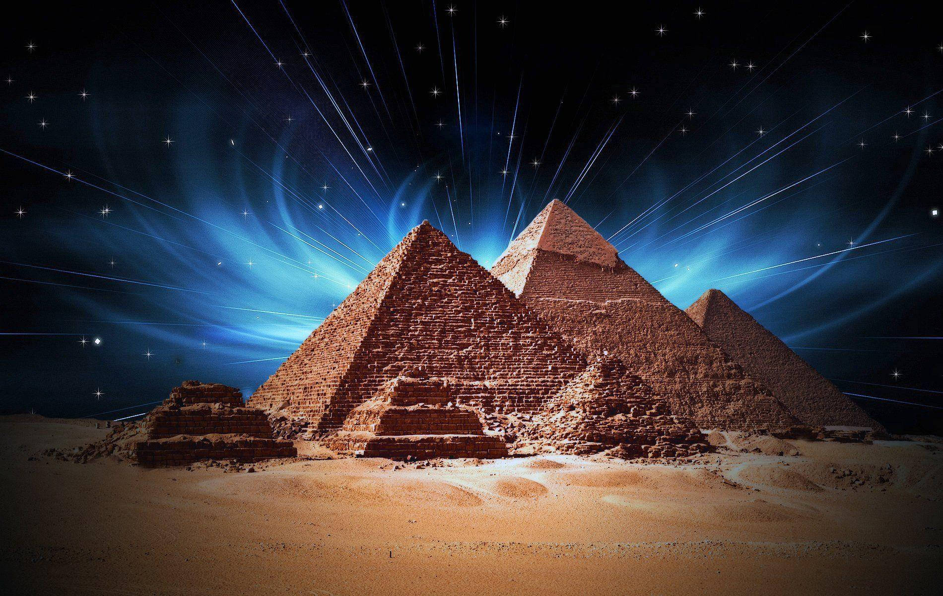 Caption: Majestic Illumination Of Cairo Pyramids At Night Background