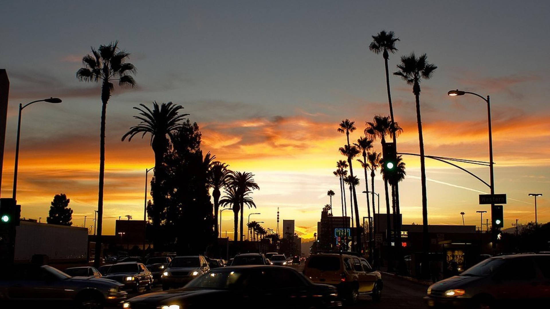 Caption: Majestic Los Angeles Sunset Over The Iconic Boulevard Background