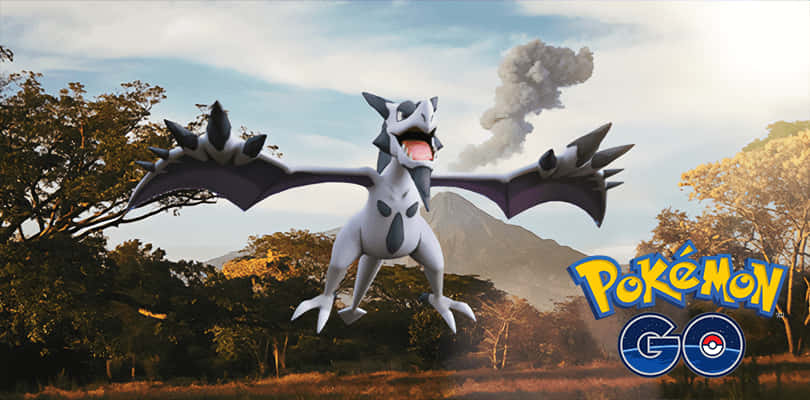 Caption: Majestic Mega Aerodactyl Soaring Before A Volcano Background