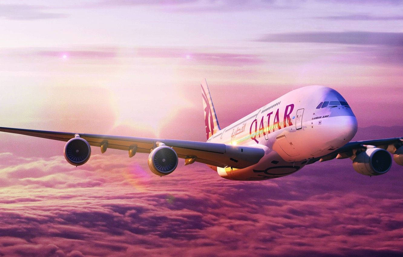 Caption: Majestic Qatar Airways Soaring Above Candy Floss Clouds Background