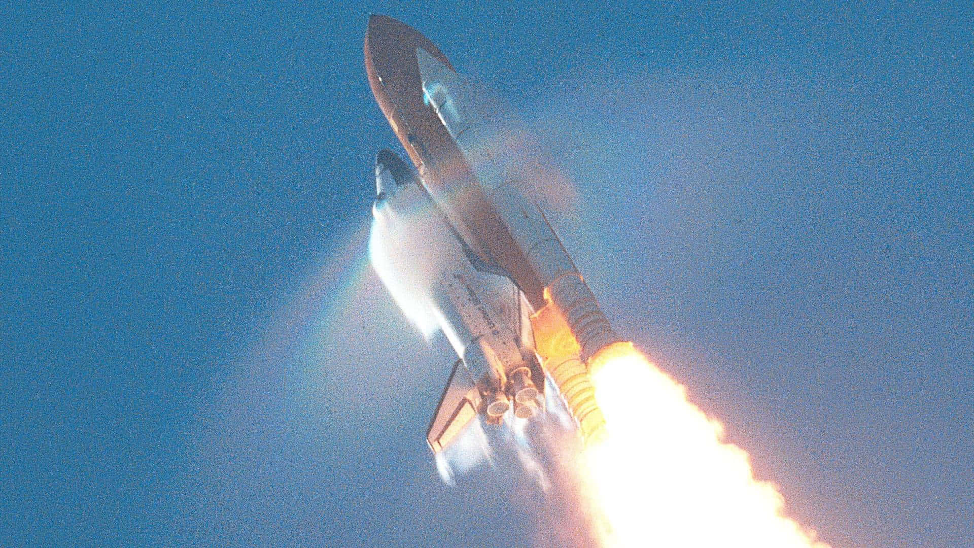 Caption: Majestic Space Shuttle In Flight Background