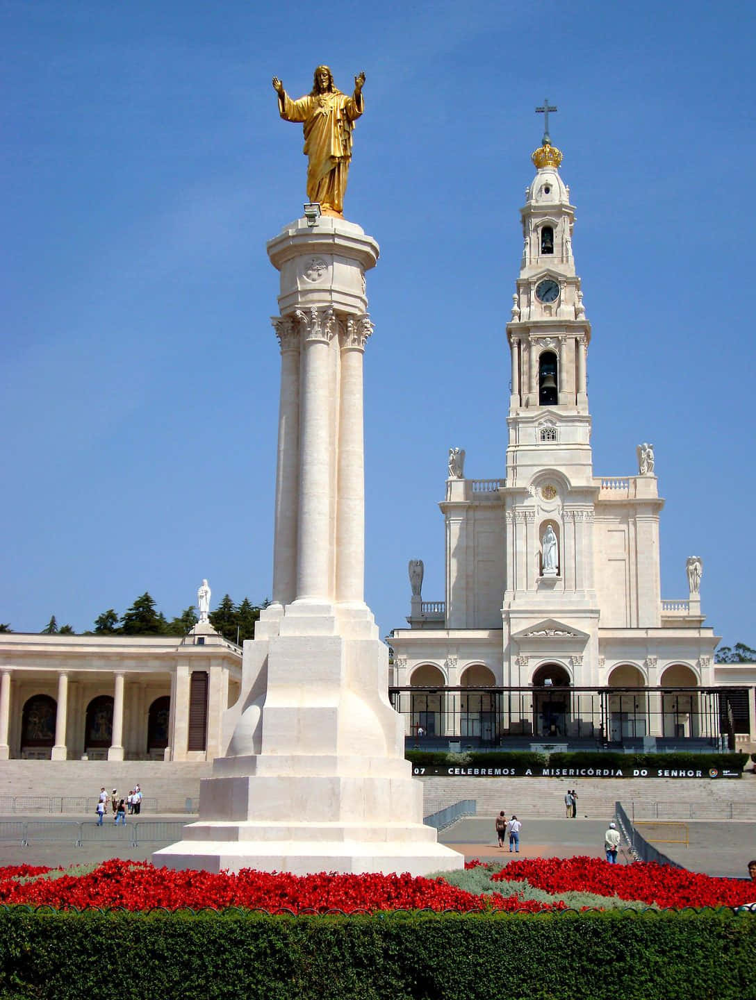 Caption: Majestic Statue Of Jesus At Fatima Sanctuary Background