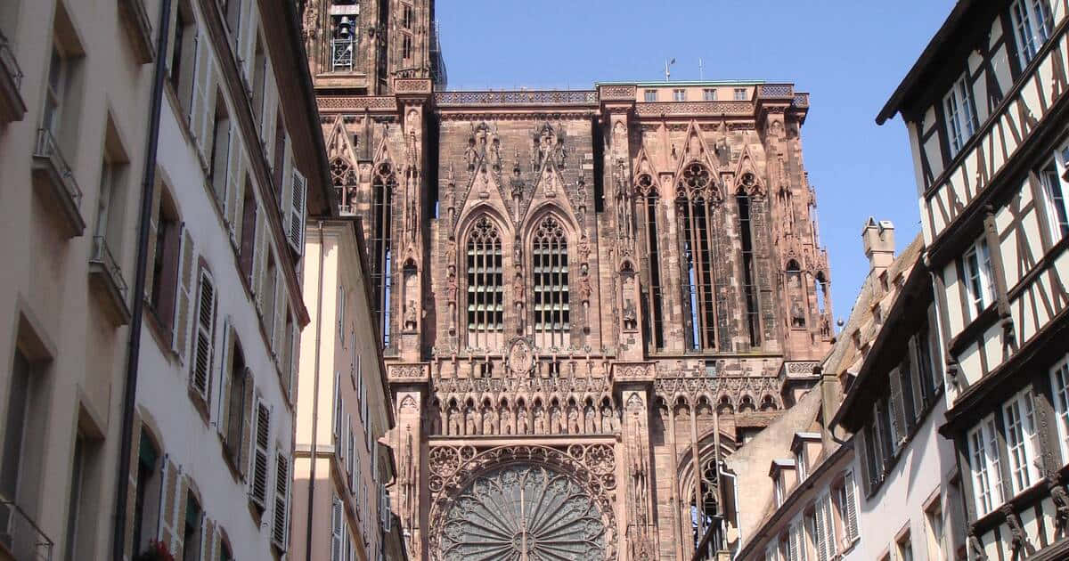 Caption: Majestic Strasbourg Cathedral Against A Beautiful Twilight Sky Background
