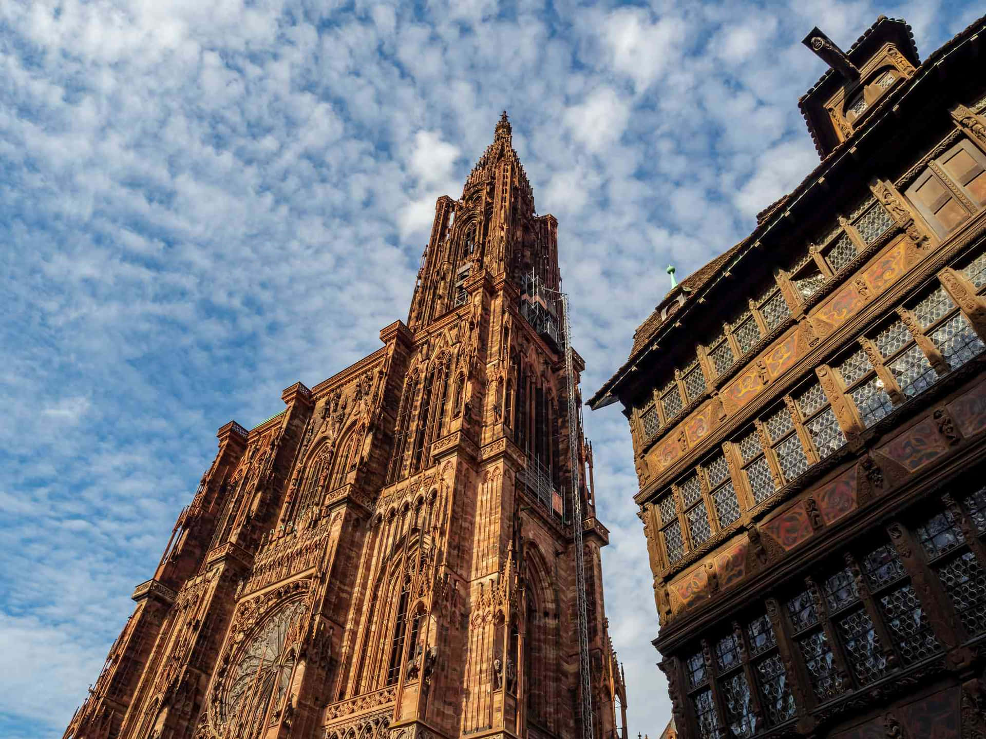 Caption: Majestic Strasbourg Cathedral In France Under A Beautiful Skyline Background