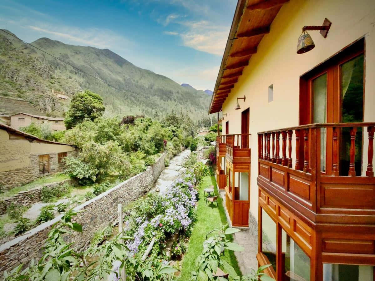 Caption: Majestic Sunset At The Ollantaytambo Sol Ollantay Hotel Background