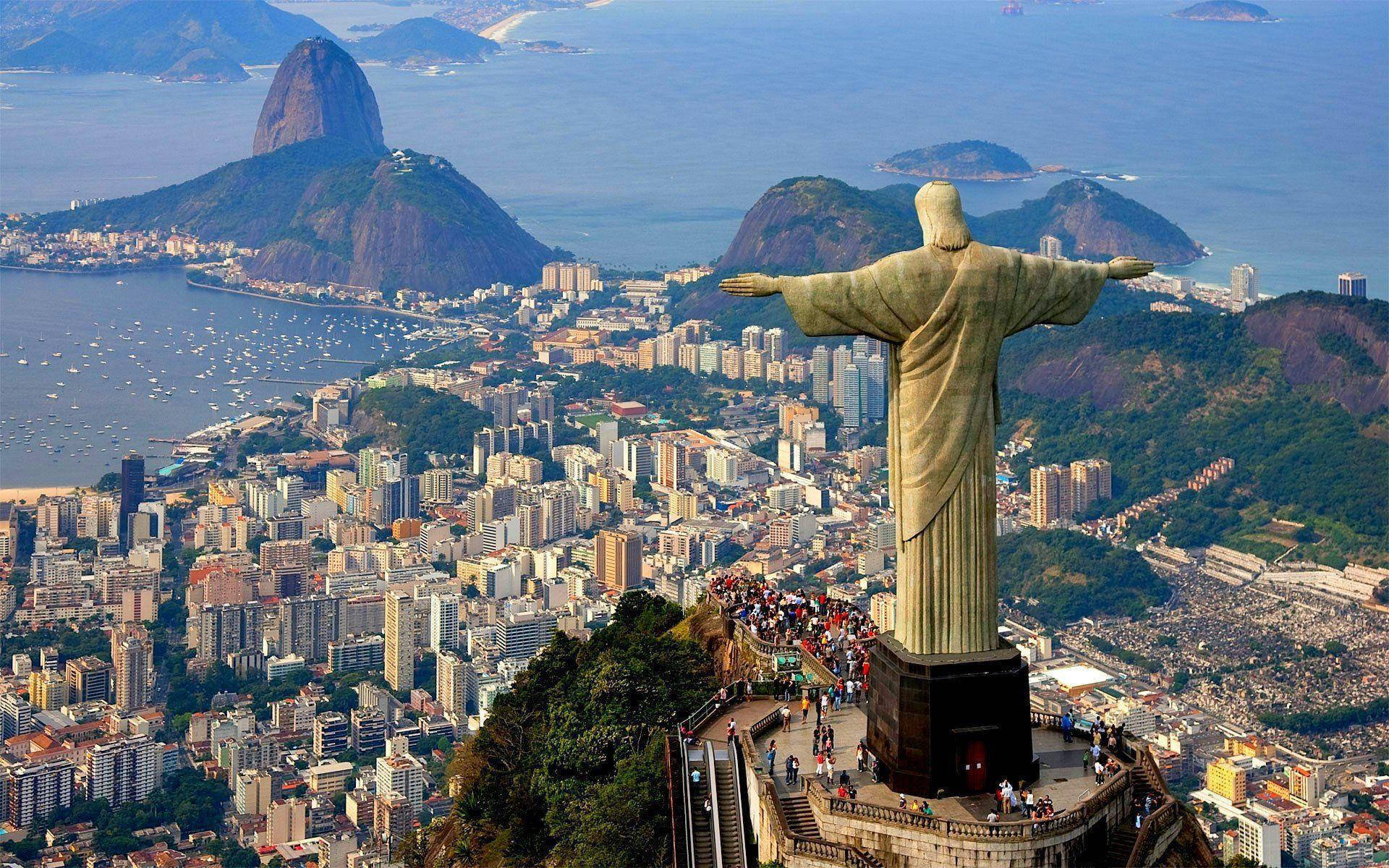 Caption: Majestic View Of Christ The Redeemer Overlooking South America Background