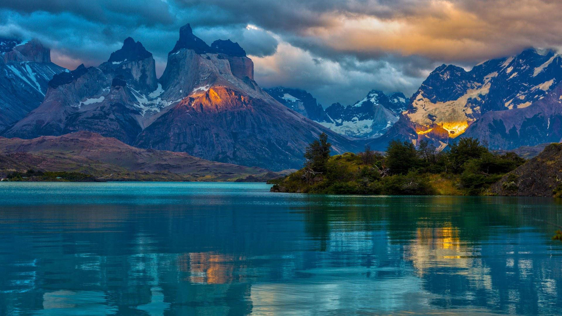 Caption: Majestic View Of Fitz Roy Near Lake In Argentina Background