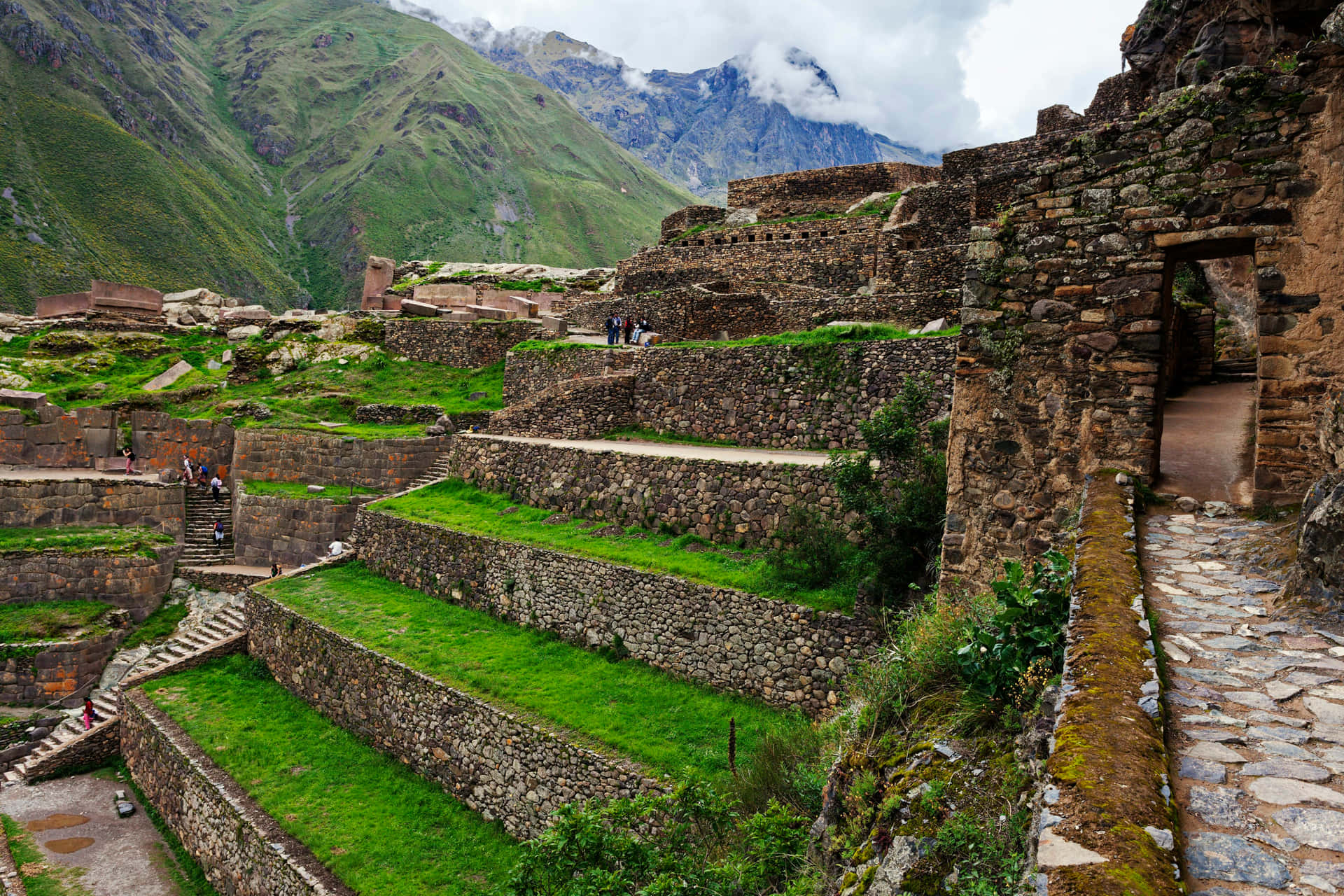 Caption: Majestic View Of The 150-step Staircase In Ollantaytambo Background