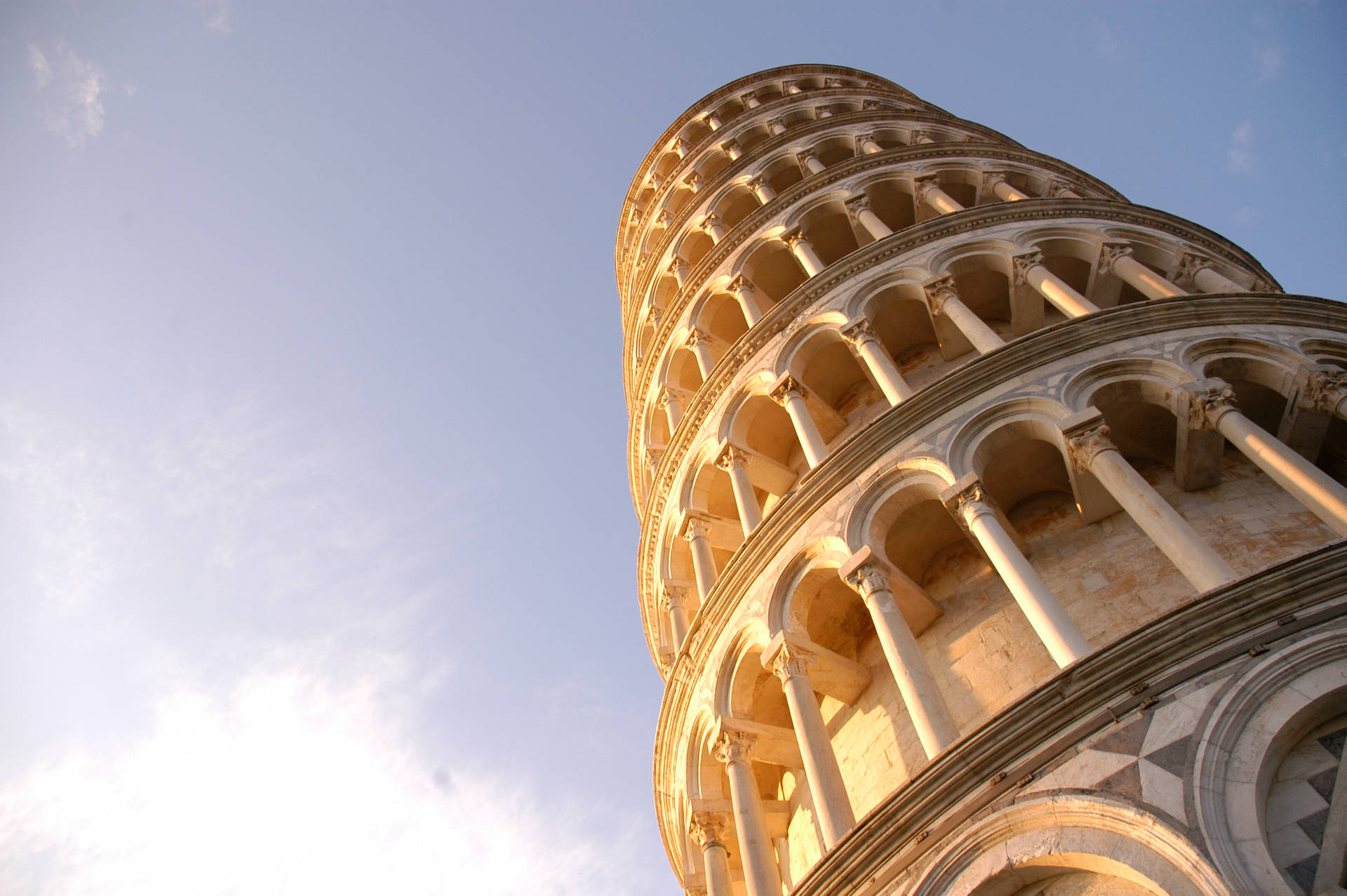 Caption: Majestic View Of The Leaning Tower Of Pisa Background