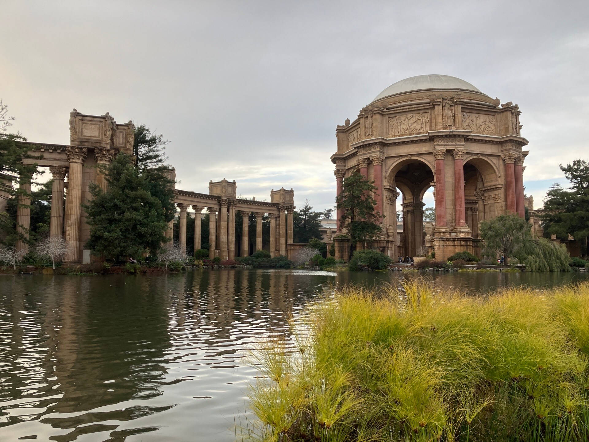 Caption: Majestic View Of The Palace Of Fine Arts By The Lagoon Background