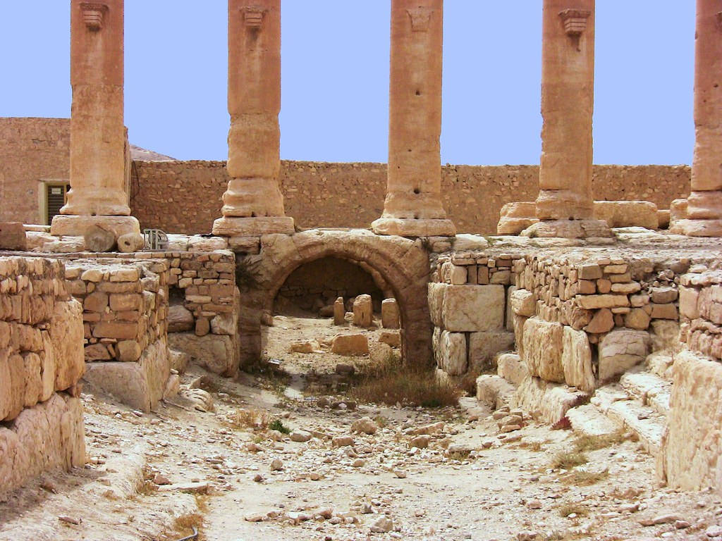 Caption: Majestic View Of The Temple Of Baal In Palmyra Background