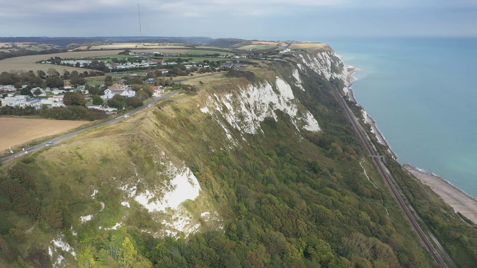 Caption: Majestic View Of The White Cliffs Of Dover Background