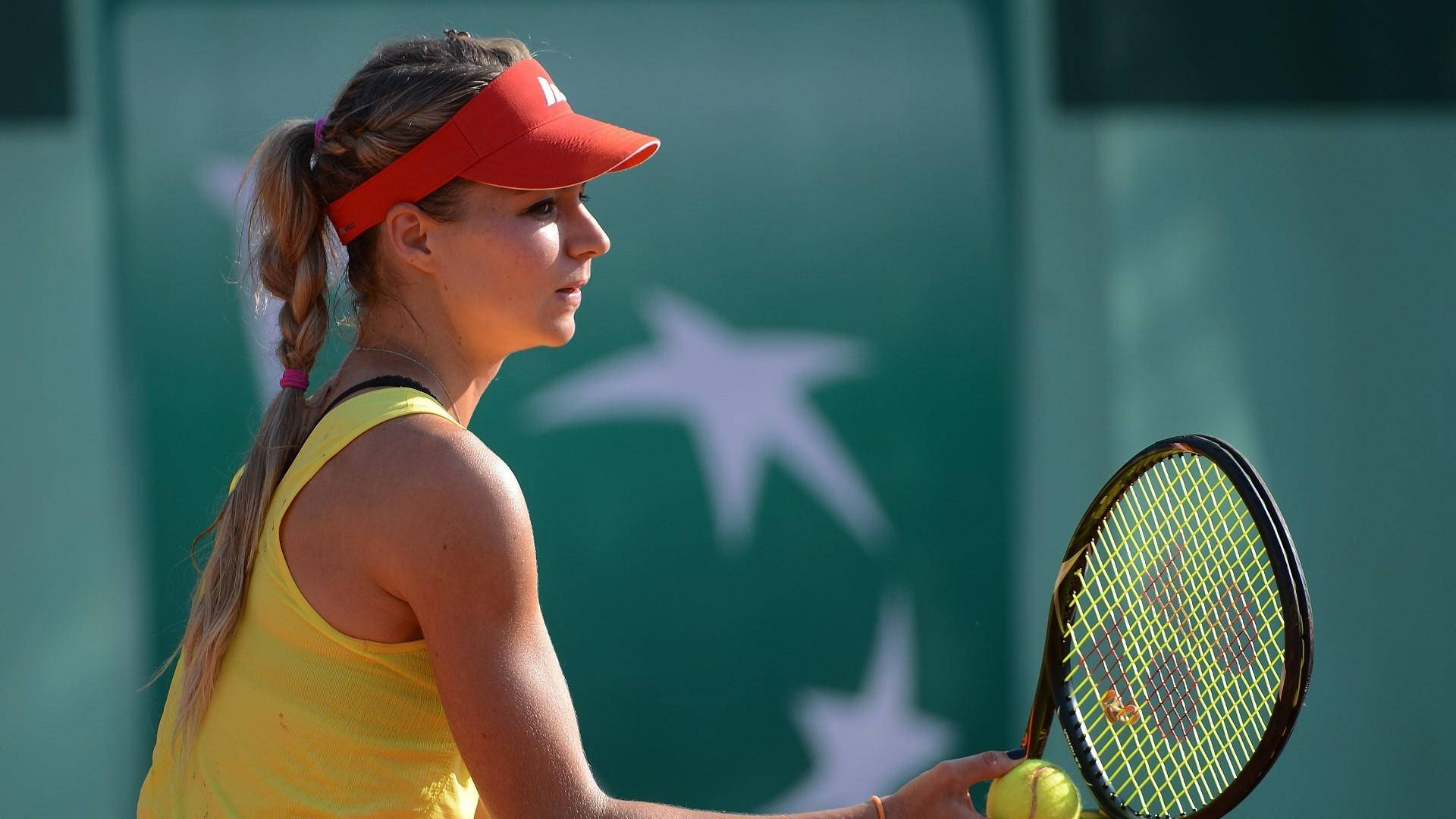 Caption: Maria Kirilenko Holding A Tennis Racket And Ball Background