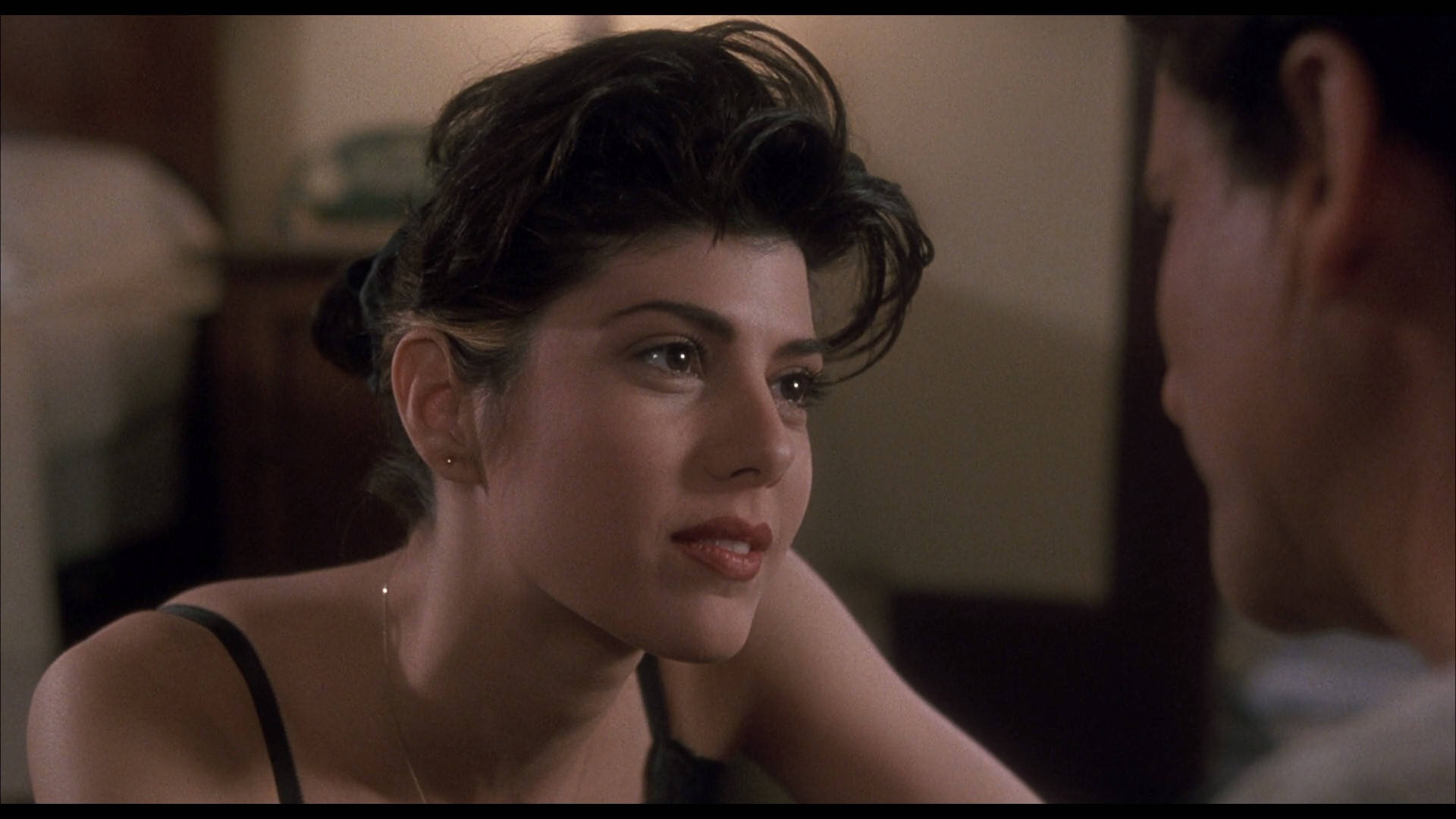 Caption: Marisa Tomei Posing Artistically, Flaunting Her Stunning Undercut Hairstyle.