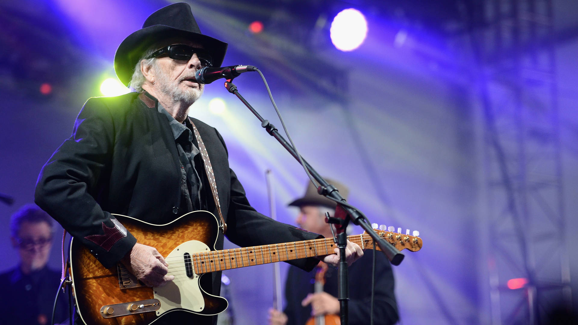 Caption: Merle Haggard - The Luminance Of Country Music Background