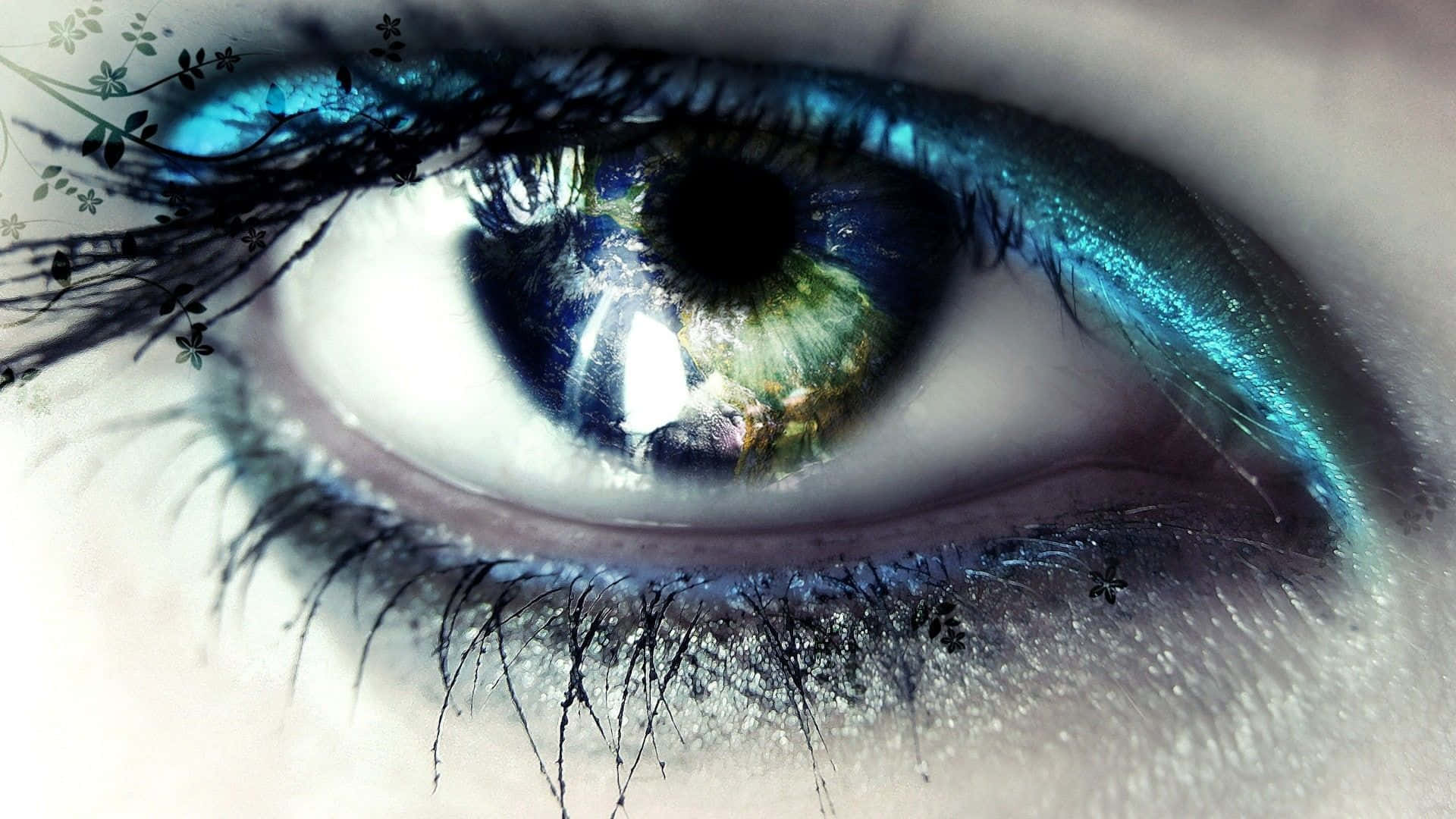 Caption: Mesmerizing Closeup Of An Eye With Metallic Blue Liners