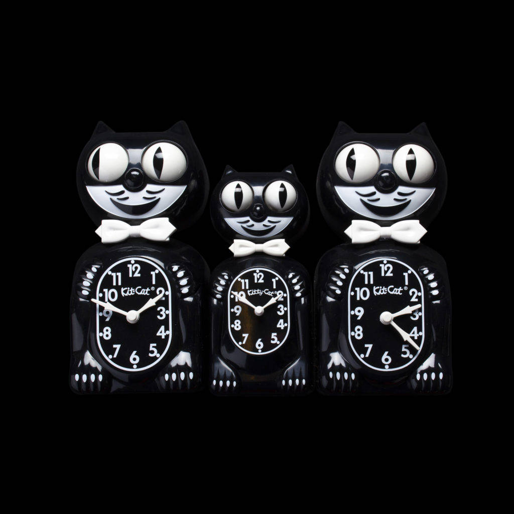 Caption: Mesmerizing Journey Through Time- Artistic Aesthetic Kit-cat Clocks Wallpaper Background