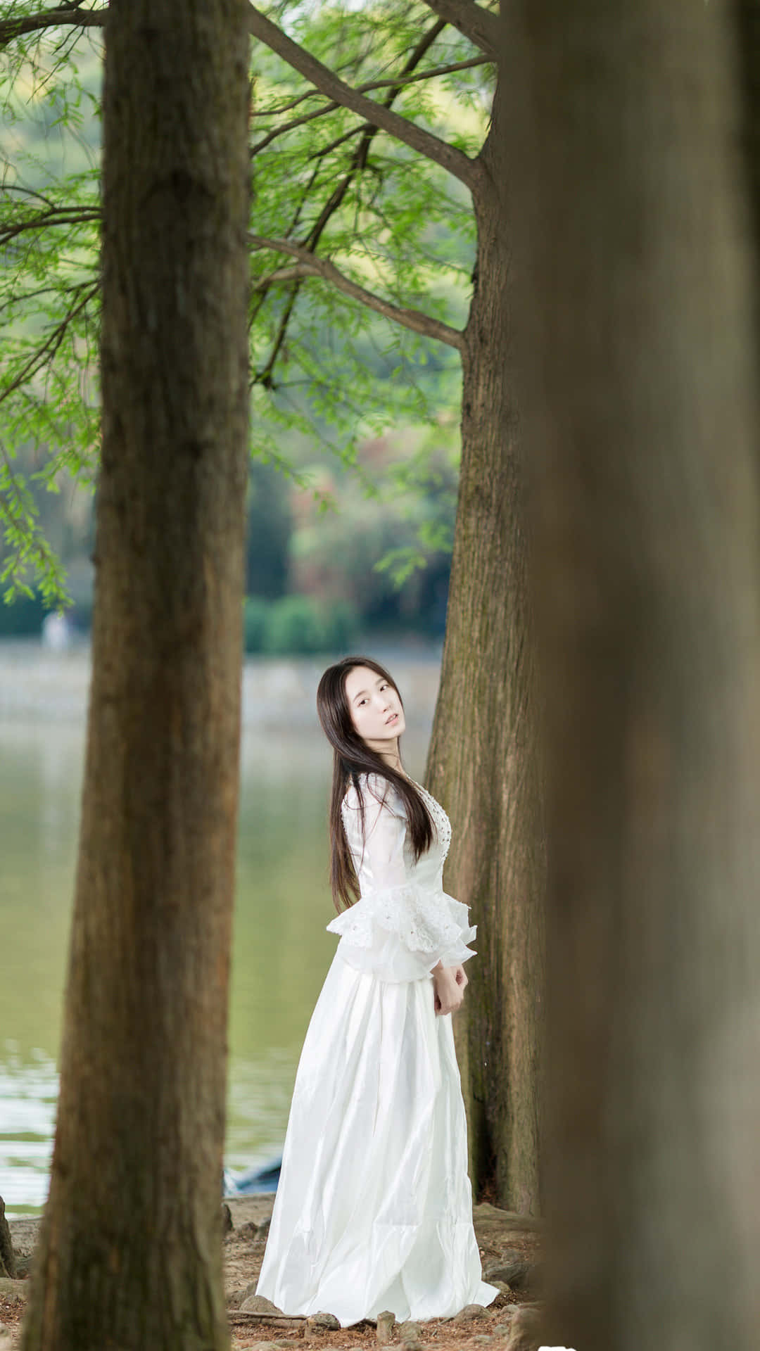 Caption: Mesmerizing Korean Beauty In A White Dress Background