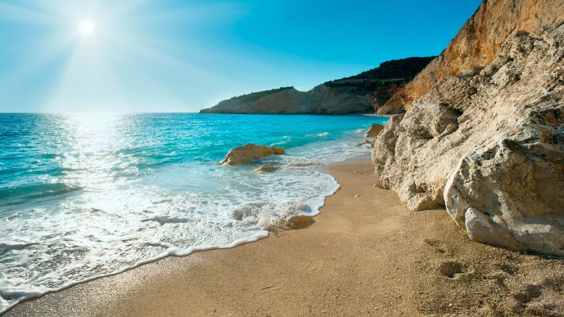 Caption: Mesmerizing View Of The Mediterranean Sea Coast Background