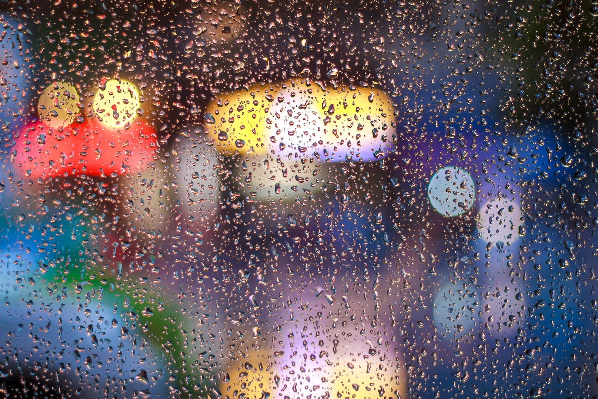 Caption: Mesmerizing View Through Wet Glass Background