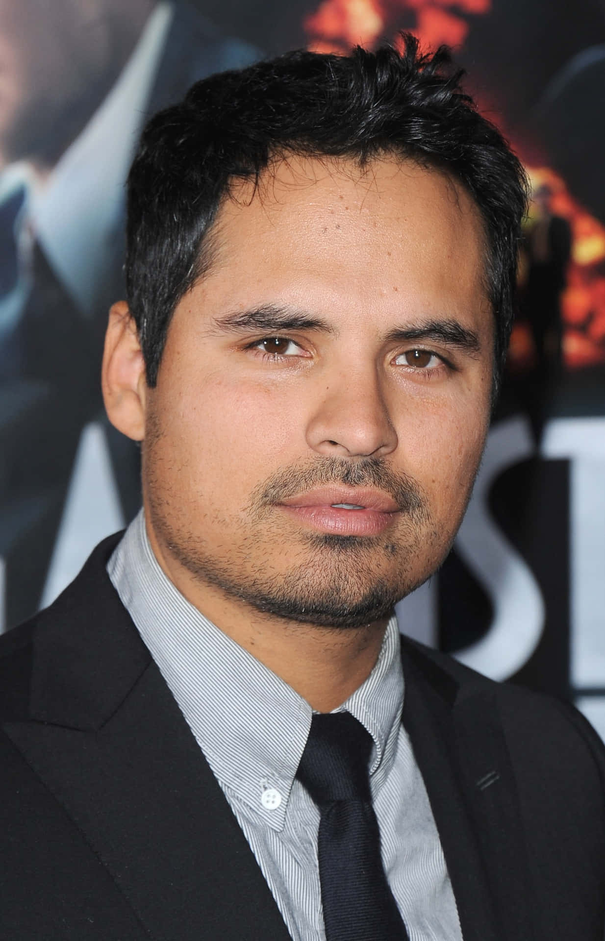 Caption: Michael Peña In Cinematic Form Background