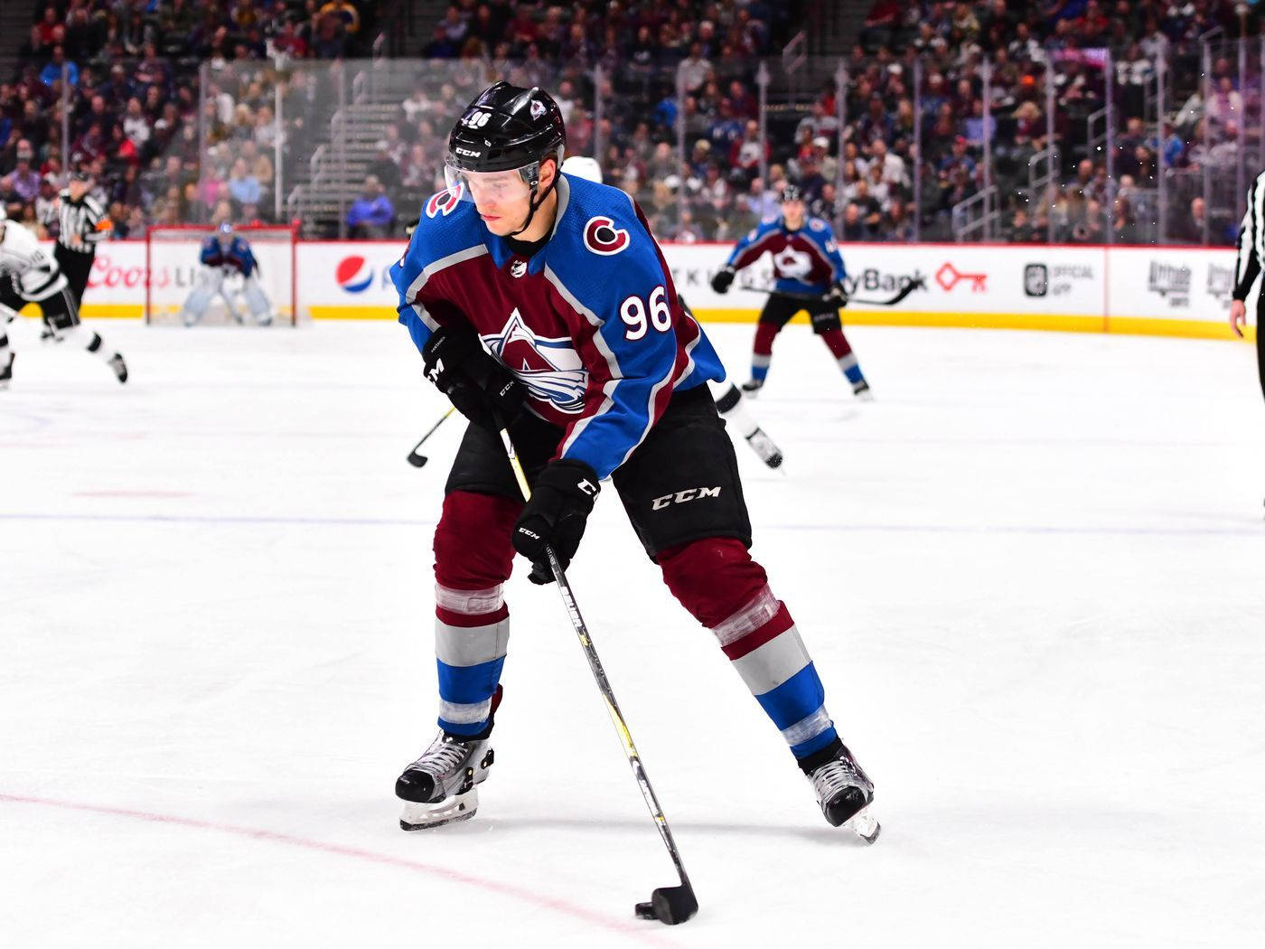 Caption: Mikko Rantanen Showing Skillful Control Of The Hockey Puck. Background